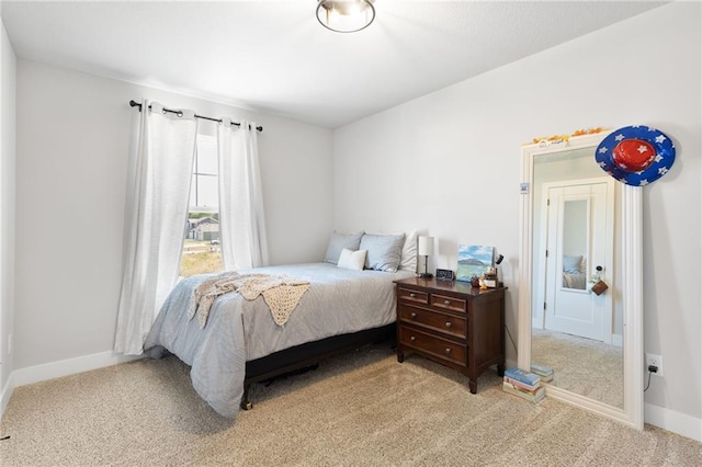 462 SE 90th Rd, Warrensburg, MO 64093 - carpeted bedroom featuring baseboards