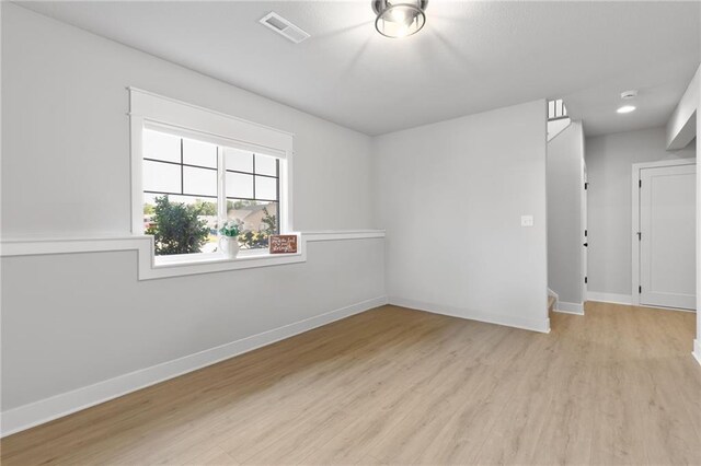 462 SE 90th Rd, Warrensburg, MO 64093 - spare room featuring light wood-style floors and a smoke detector