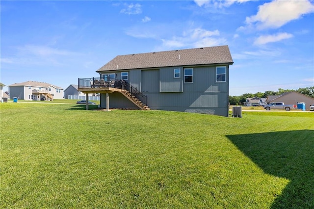 462 SE 90th Rd, Warrensburg, MO 64093 - back of property with stairs, a deck, a lawn, and roof with shingles