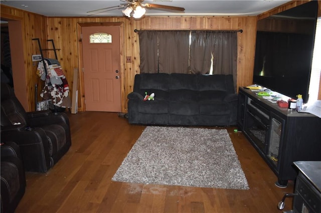 21570 Mclouth Rd, Mc Louth, KS 66054 - living area featuring a ceiling fan, wooden walls, and wood finished floors