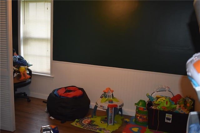 21570 Mclouth Rd, Mc Louth, KS 66054 - recreation room featuring wood finished floors and a wainscoted wall
