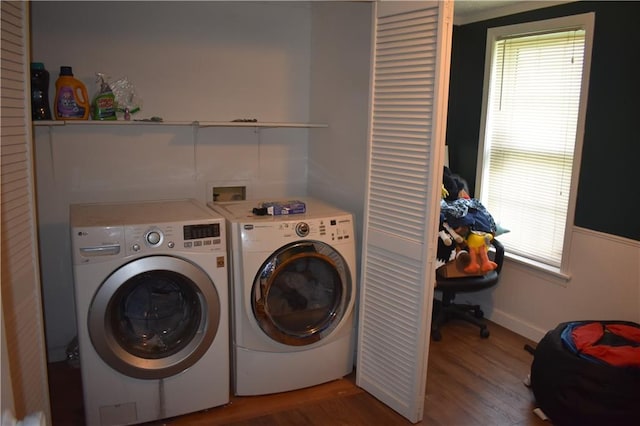 21570 Mclouth Rd, Mc Louth, KS 66054 - washroom featuring washing machine and clothes dryer, wood finished floors, and healthy amount of natural light