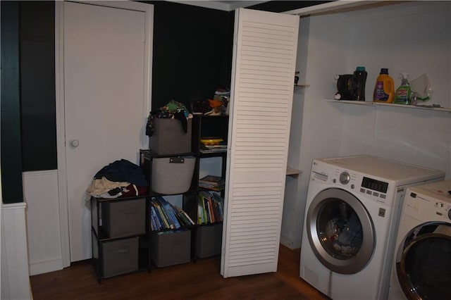 21570 Mclouth Rd, Mc Louth, KS 66054 - laundry area featuring washing machine and dryer, wood finished floors, and wainscoting