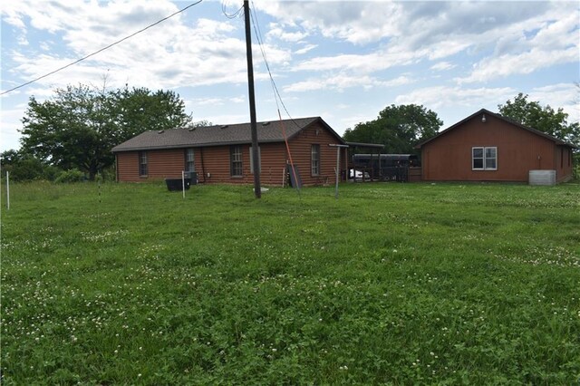 21570 Mclouth Rd, Mc Louth, KS 66054 - rear view of house with a yard