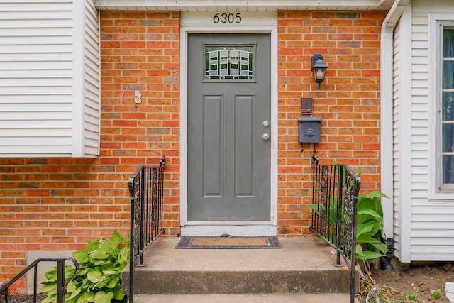 6305 N Bales Ave, Gladstone, MO 64119 - doorway to property with brick siding