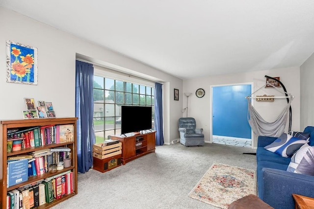 6305 N Bales Ave, Gladstone, MO 64119 - carpeted living room with baseboards