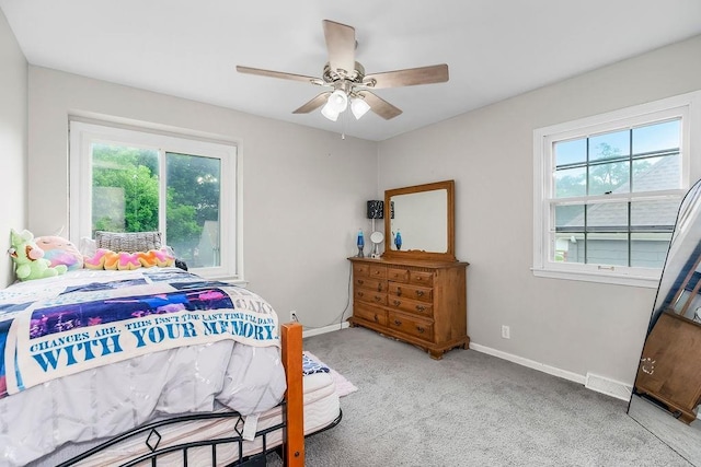 6305 N Bales Ave, Gladstone, MO 64119 - carpeted bedroom with baseboards and ceiling fan