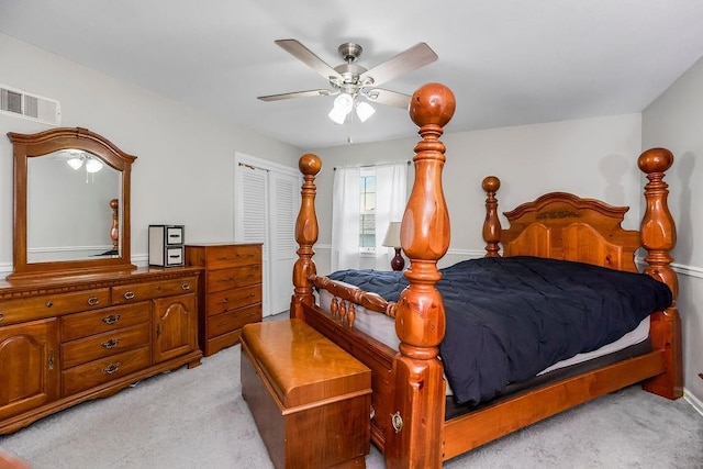 6305 N Bales Ave, Gladstone, MO 64119 - bedroom with light colored carpet, a ceiling fan, and a closet