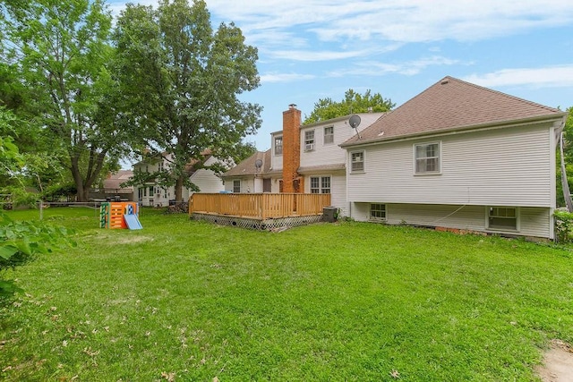 6305 N Bales Ave, Gladstone, MO 64119 - rear view of property with a lawn, a deck, roof with shingles, and a chimney