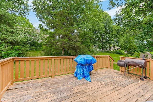 6305 N Bales Ave, Gladstone, MO 64119 - wooden deck featuring a yard, view of scattered trees, and area for grilling