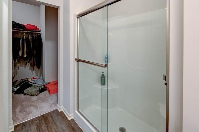 8025 SE 6th Ter, Blue Springs, MO 64014 - full bathroom featuring a shower stall, wood finished floors, and a walk in closet