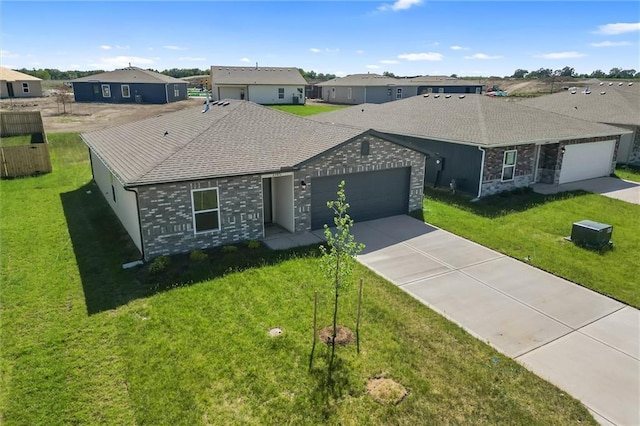 37770 W 207th Ter, Edgerton, KS 66021 - ranch-style house featuring an attached garage, concrete driveway, a front yard, a shingled roof, and a residential view