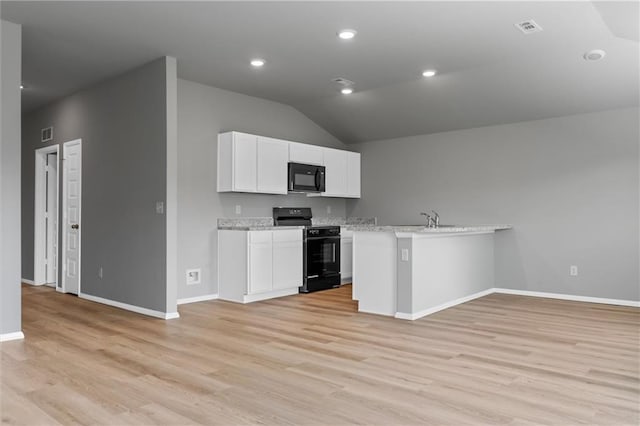 37770 W 207th Ter, Edgerton, KS 66021 - kitchen with black appliances, light wood-style flooring, white cabinetry, open floor plan, and lofted ceiling