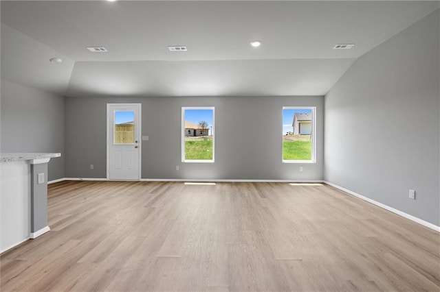 37770 W 207th Ter, Edgerton, KS 66021 - unfurnished living room featuring vaulted ceiling, light wood-type flooring, and recessed lighting