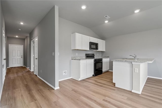 37770 W 207th Ter, Edgerton, KS 66021 - kitchen with black appliances, light wood-type flooring, white cabinetry, recessed lighting, and vaulted ceiling