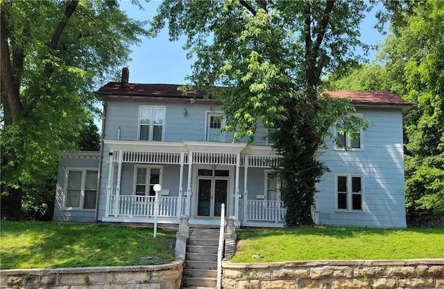 605 Hall St, Saint Joseph, MO 64501 - view of front of house featuring covered porch, a front lawn, and french doors