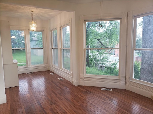 605 Hall St, Saint Joseph, MO 64501 - unfurnished sunroom featuring hardwood / wood-style floors