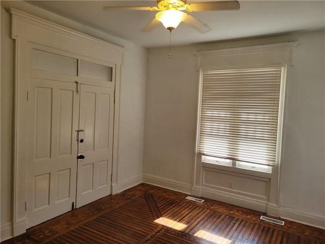 605 Hall St, Saint Joseph, MO 64501 - unfurnished bedroom with ceiling fan and dark wood finished floors