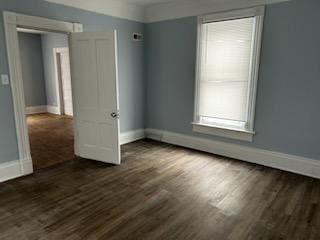 605 Hall St, Saint Joseph, MO 64501 - spare room with baseboards and dark wood-style floors