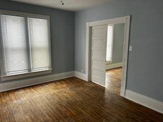 605 Hall St, Saint Joseph, MO 64501 - empty room with baseboards and wood finished floors