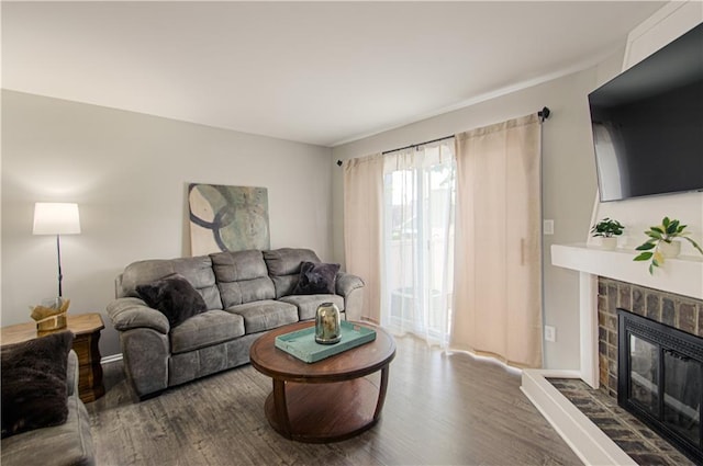 12131 W 82nd Ter, Lenexa, KS 66215 - living room with wood finished floors and a glass covered fireplace