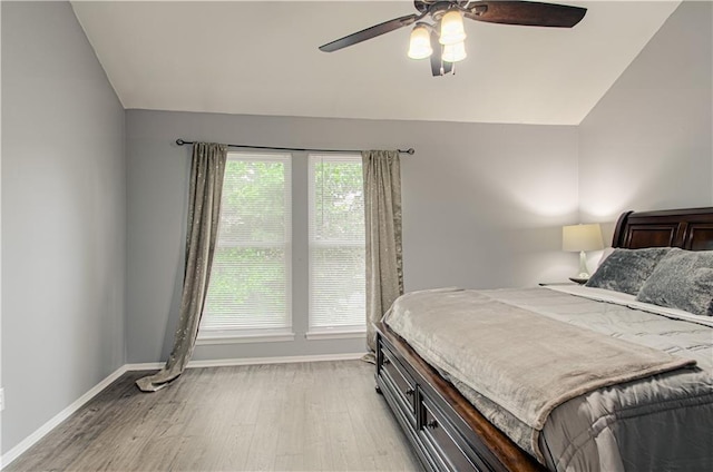 12131 W 82nd Ter, Lenexa, KS 66215 - bedroom with lofted ceiling, light wood finished floors, and a ceiling fan