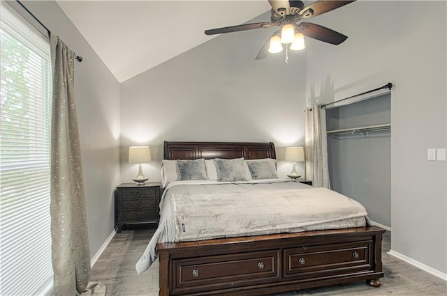 12131 W 82nd Ter, Lenexa, KS 66215 - bedroom featuring light wood-style floors, vaulted ceiling, and a ceiling fan