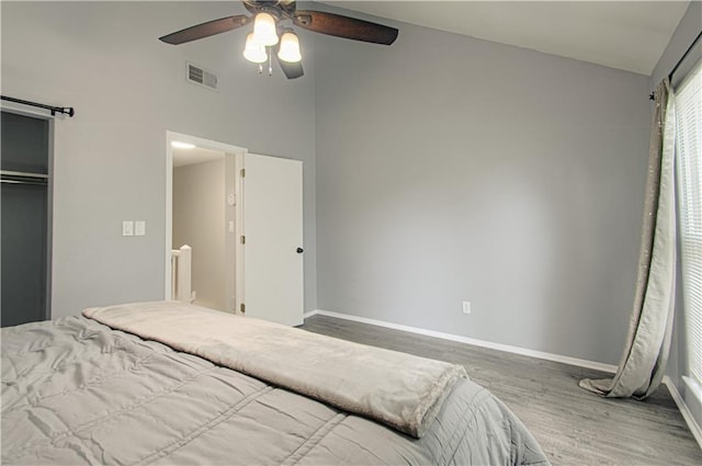 12131 W 82nd Ter, Lenexa, KS 66215 - bedroom with wood finished floors, vaulted ceiling, ceiling fan, and a closet