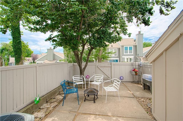12131 W 82nd Ter, Lenexa, KS 66215 - fenced backyard with a patio area and an outdoor fire pit