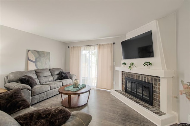 12131 W 82nd Ter, Lenexa, KS 66215 - living room featuring a brick fireplace and wood finished floors