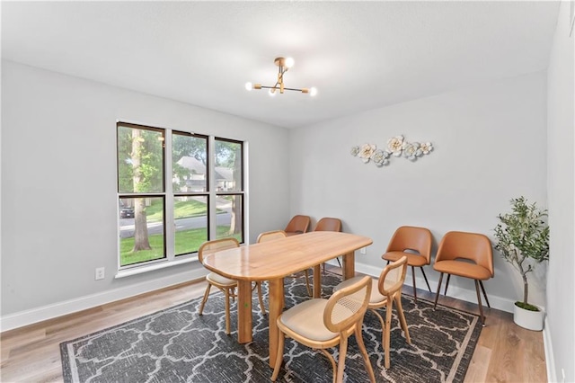 10312 W 48th Ter, Shawnee, KS 66203 - dining space featuring a chandelier and wood finished floors