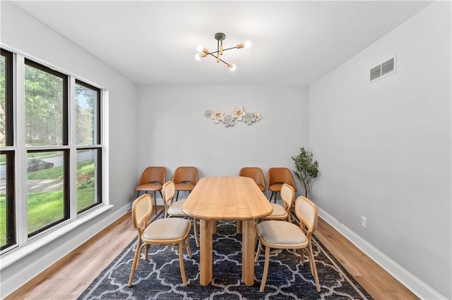 10312 W 48th Ter, Shawnee, KS 66203 - dining space with a chandelier and light wood-style flooring
