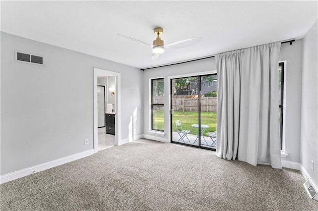 10312 W 48th Ter, Shawnee, KS 66203 - carpeted spare room featuring a ceiling fan and baseboards