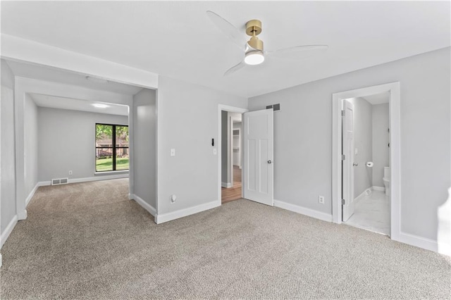10312 W 48th Ter, Shawnee, KS 66203 - unfurnished bedroom featuring light carpet, ensuite bath, and a ceiling fan
