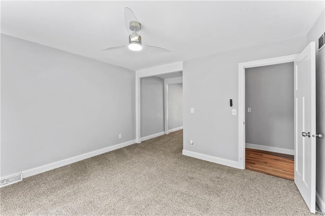 10312 W 48th Ter, Shawnee, KS 66203 - carpeted spare room with a ceiling fan and baseboards