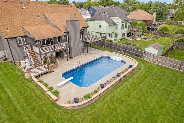 18807 E 34th St, Independence, MO 64057 - view of pool with stairs, a diving board, a fenced backyard, a wooden deck, and a residential view