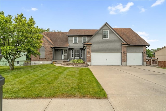 18807 E 34th St, Independence, MO 64057 - view of front of property with a front yard, driveway, brick siding, and an attached garage