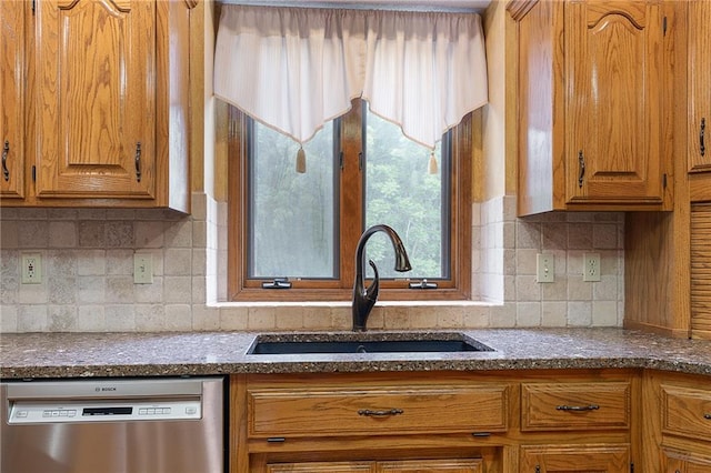 18807 E 34th St, Independence, MO 64057 - kitchen with stainless steel dishwasher, healthy amount of natural light, and brown cabinets