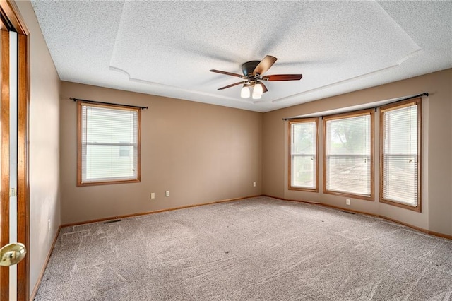 18807 E 34th St, Independence, MO 64057 - carpeted empty room with a textured ceiling, plenty of natural light, and ceiling fan