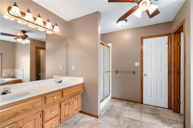 18807 E 34th St, Independence, MO 64057 - bathroom with ceiling fan, a shower stall, a garden tub, and double vanity