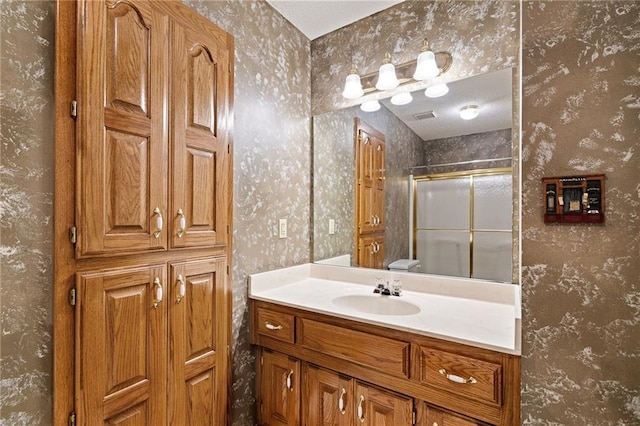 18807 E 34th St, Independence, MO 64057 - bathroom with wallpapered walls, vanity, and a stall shower
