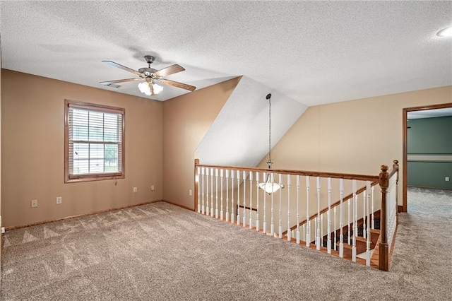 18807 E 34th St, Independence, MO 64057 - spare room featuring a ceiling fan, carpet flooring, and a textured ceiling