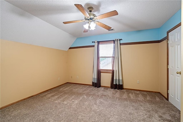 18807 E 34th St, Independence, MO 64057 - additional living space with carpet flooring, ceiling fan, a textured ceiling, and vaulted ceiling