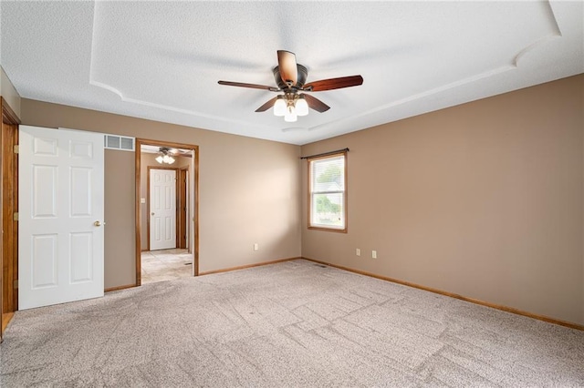 18807 E 34th St, Independence, MO 64057 - unfurnished bedroom with light colored carpet, ceiling fan, and a textured ceiling