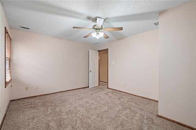 18807 E 34th St, Independence, MO 64057 - empty room with carpet floors, ceiling fan, and a textured ceiling