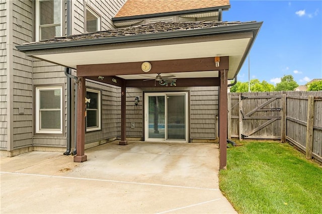 18807 E 34th St, Independence, MO 64057 - view of exterior entry featuring ceiling fan, a patio, and a gate