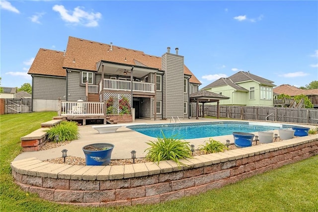 18807 E 34th St, Independence, MO 64057 - view of swimming pool featuring a fenced backyard, ceiling fan, a deck, a gazebo, and a patio