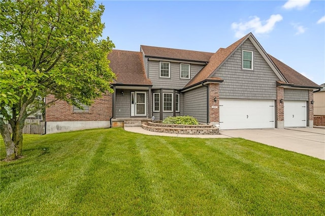 18807 E 34th St, Independence, MO 64057 - view of front of property featuring a front yard, concrete driveway, a garage, and brick siding