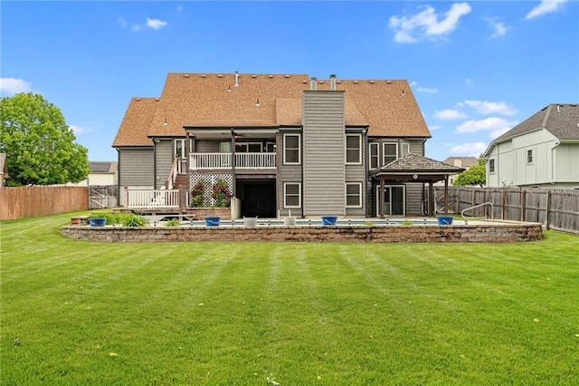 18807 E 34th St, Independence, MO 64057 - back of house featuring a fenced backyard, a patio, a chimney, and a wooden deck