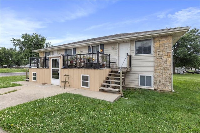 301-A N 3rd St, Odessa, MO 64076 - back of property with a yard and stone siding